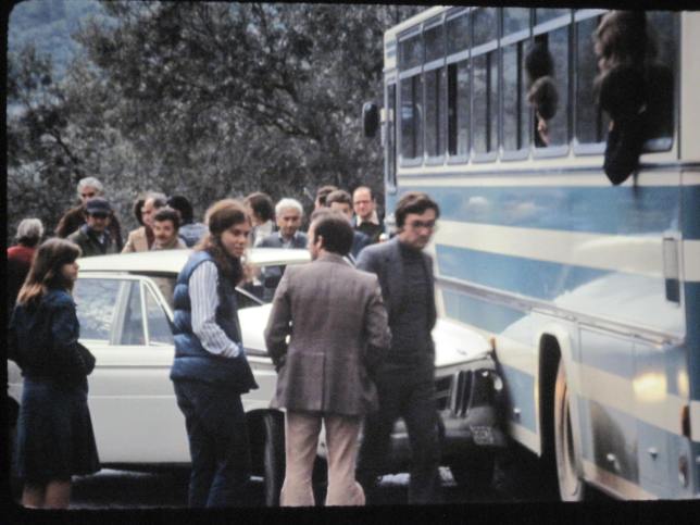 Peggy hanging out with a travel friend... and a car that crashed into their bus!